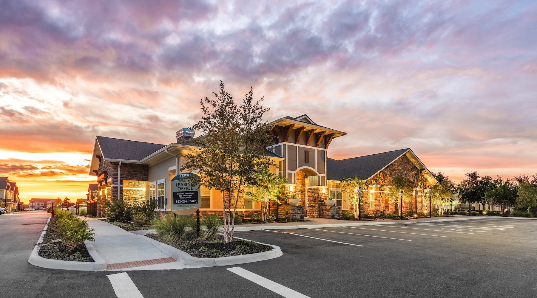 the exterior of a building at sunset